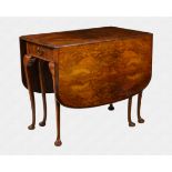 A 1920s figured walnut Queen Anne style dropleaf dining table the well figured quarter veneered