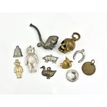 A 14ct gold bull's head charm together with a small collection of other charms, some silver. (11)