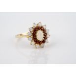 A 9ct gold, opal and garnet cluster ring size O.