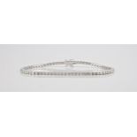 An 18ct white gold and diamond line bracelet the brilliant cut diamonds totalling 2.85ct, length
