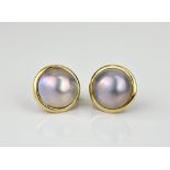 A pair of 14ct yellow gold Mabé pearl earrings the 13mm. grey-pink toned pearls within plain gold