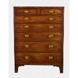 A George III mahogany tall straight front chest of seven graduated, oak lined drawers, the top