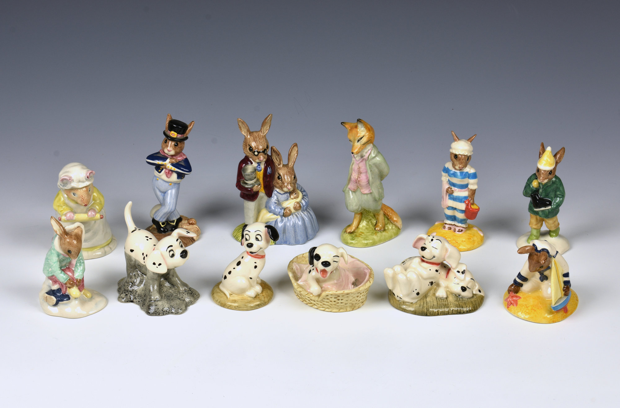 A collection of Royal Doulton figurines comprising Disney's 101 Dalmatians - Rolly; Lucky; Patch