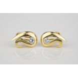 A pair of 18ct yellow gold and diamond 'swan' earrings each set with a single brilliant cut diamond,