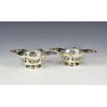 A pair of George V pierced silver bon-bon dishes maker's marks rubbed, London 1914, of shaped oval