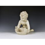A 19th century style imitation marble figure of a kneeling child holding a bird on a leaf, 15in. (