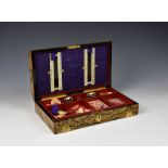 A Victorian burr walnut, faux grained and agate mounted games compendium by Mechi of London the