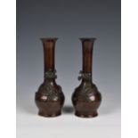 A pair of small Japanese bronze dragon vases bottle form, c.1900, red-brown patination, 6 1/8in. (