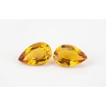 A pair of loose, unmounted citrine gemstones pear cut, 14.51ct total. (2)