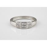 A platinum and diamond ring set with twelve princess cut diamonds, total weight approx. 0.50ct, size