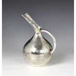 A planished sterling silver jug, probably South American late 20th century, of tapered bulbous form,