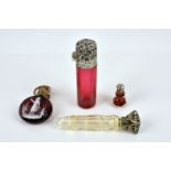 A Victorian cranberry glass and gilt metal scent bottle with Mary Gregory child overlay decoration