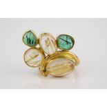 A handmade abstract 18ct gold and rutilated quartz ring set with five cabochon quartz stones in