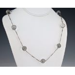 A mid-century silver and rock crystal necklace the filigree link chain set with polished rock