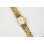 A ladies 9ct gold Rotary quartz wrist watch the white, rounded rectangular dial with applied gilt