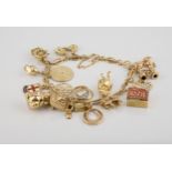 A 9ct gold fancy link full charm bracelet