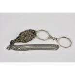 A pair of Continental silver and marcasite lorgnettes stamped 935, the shaped case with pierced