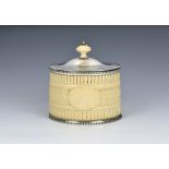 A Victorian ivory and silver plated tea caddy by Henry Atkin, of oval form, the ivory body carved