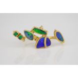 An unusual handmade 18ct yellow gold and black opal double shank ring the two open shanks with