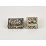Two silver pill boxes the first, stamped 925, of rectangular form with floral and foliate repoussé