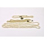 Three freshwater pearl necklaces one double strand with silver clasp; one single strand with gold