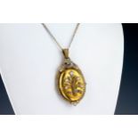 A Victorian 18ct yellow gold, pearl and diamond pendant locket the oval locket decorated with a