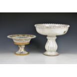 A tin glazed terracotta shallow pedestal bowl with a crimped rim, the squat fluted baluster stem