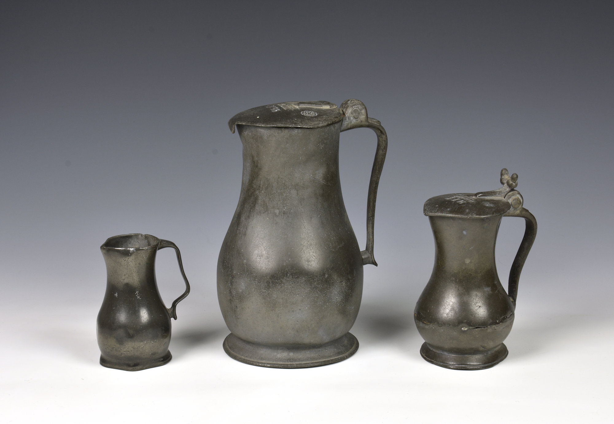 A matched graduated set of three 18th century Channel Islands pewter measures the largest pint size,