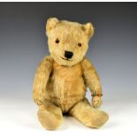 A Golden mohair teddy bear c. 1930's, possibly Chiltern, orange glass eyes, four stitched claws,