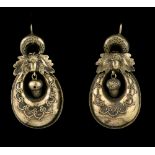 A pair of antique 18ct yellow gold earrings the hollow bag shaped drops suspended from an oak leaf