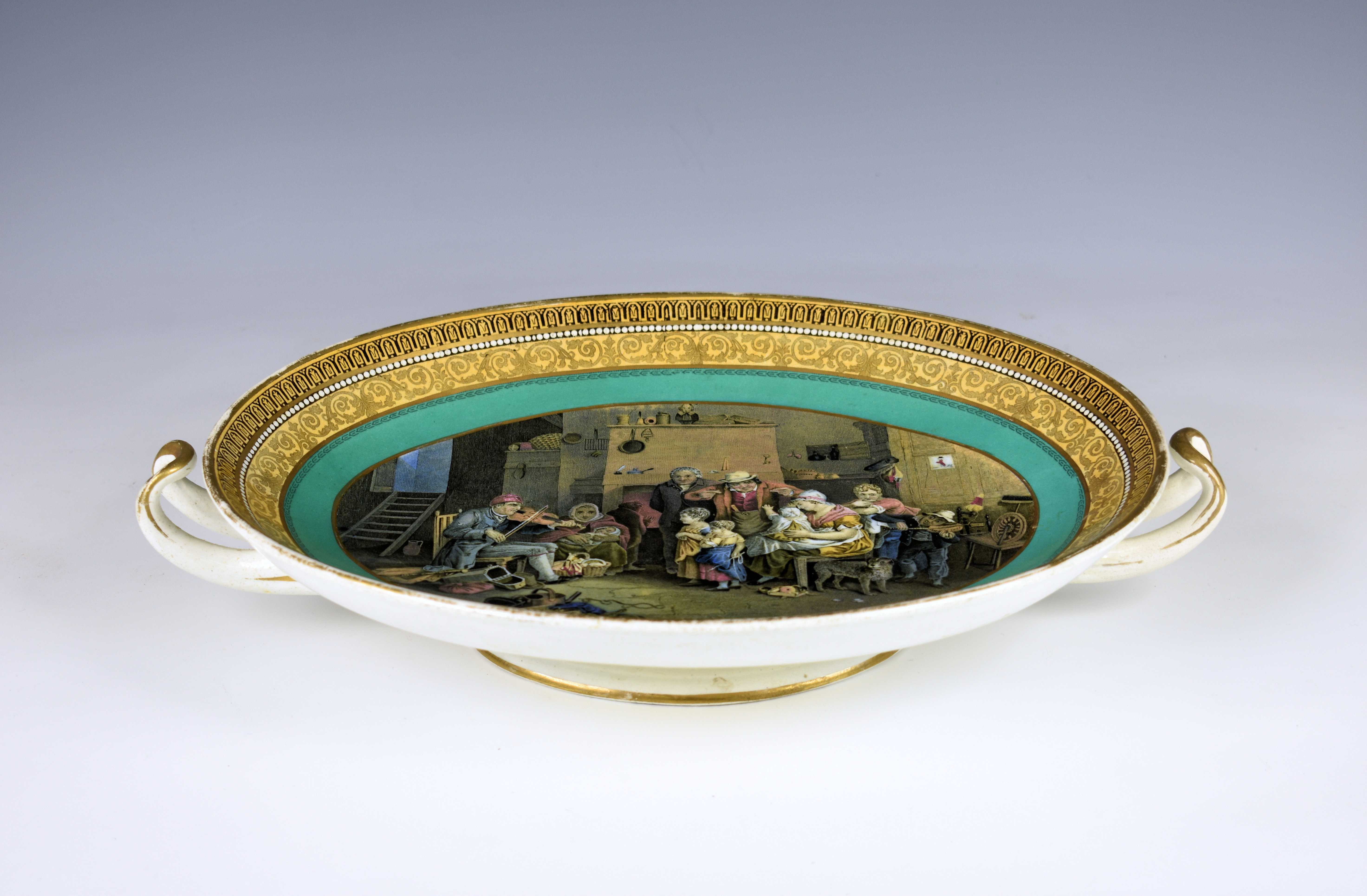 A two handled oval Prattware saucer dish 19th century, the interior scene of a family being