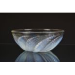 A Rene Lalique opalescent and clear glass Fleurons Bowl with spiralled decoration, etched 'R.