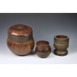 A 19th century African carved hardwood mortar with incised decoration and metal banded