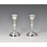 A pair of silver dwarf candlesticks W I Broadway & Co, Birmingham 1965, of typical form, 5¼in. (13.