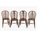 A pair of 19th century yew and elm Windsor chairs the hooped stick backs with central pierced vase