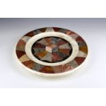 A 19th century Grand Tour specimen marble circular dish inlaid with a central cube and fan of