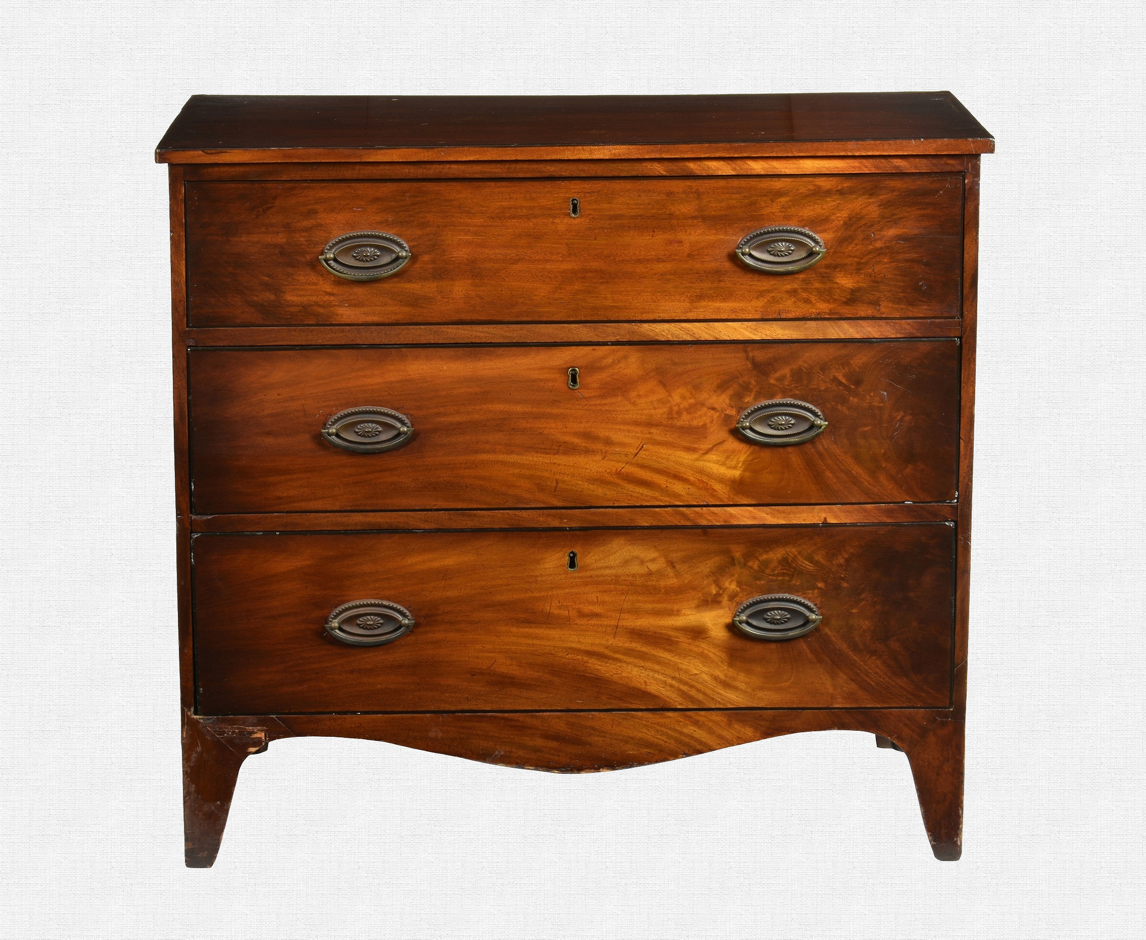 A George IV mahogany and ebony strung chest of three drawers of small proportions, the rectangular