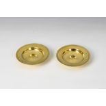 Asprey - a pair of silver gilt pin dishes or ashtrays Asprey & Co Ltd, London 1973, of circular