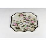 A Japanese porcelain shaped rectangular tray early 20th century, the well with decoration of