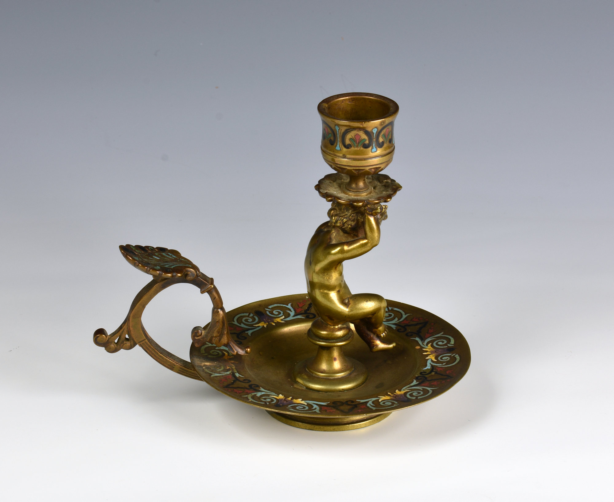 A 19th century French gilt bronze and champleve enamel chamberstick the urn sconce carried by a - Image 2 of 4