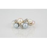 A 9ct gold, silver and white pearl and diamond ring size L.