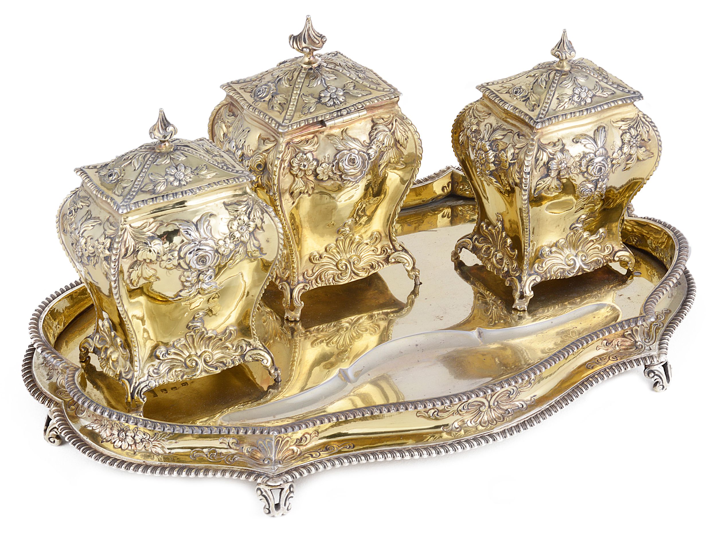 A SET OF THREE GEORGE III SILVER-GILT TEA CADDIES LATER MOUNTED AS AN INKSTAND ALL LONDON THE