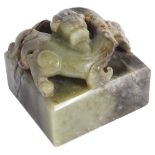 A CHINESE GREEN JADE 'CHILONG' SEAL the straight-sided rectangular seal surmounted by a high