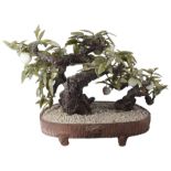 A CHINESE HARDSTONE LARGE MODEL OF A BONSAI FRUITING APPLE TREE, LATE 20TH CENTURY the leaves and
