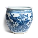 A CHINESE BLUE AND WHITE LARGE JARDINIERE, 19TH / 20TH CENTURY painted with exotic birds amidst