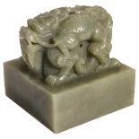 A CHINESE CELADON JADE 'DRAGON' SEAL the square seal surmounted by a pair of addorsed dragons,