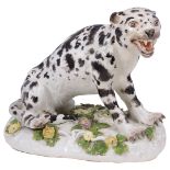 A MEISSEN FIGURE OF A LEOPARD, CIRCA 1750 the snarling cat seated on a flower applied mound base,