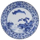 A JAPANESE KAKIEMON STYLE BLUE AND WHITE DISH, EDO PERIOD, LATE 17TH CENTURY painted with a stylised
