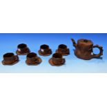 A Chinese Yixing style tea set in brown bisque porcelain, comprising teapot and 6 cups and