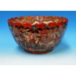 An early 20th century large oriental Satsuma punch bowl of ribbed form, decorated in the 100 faces